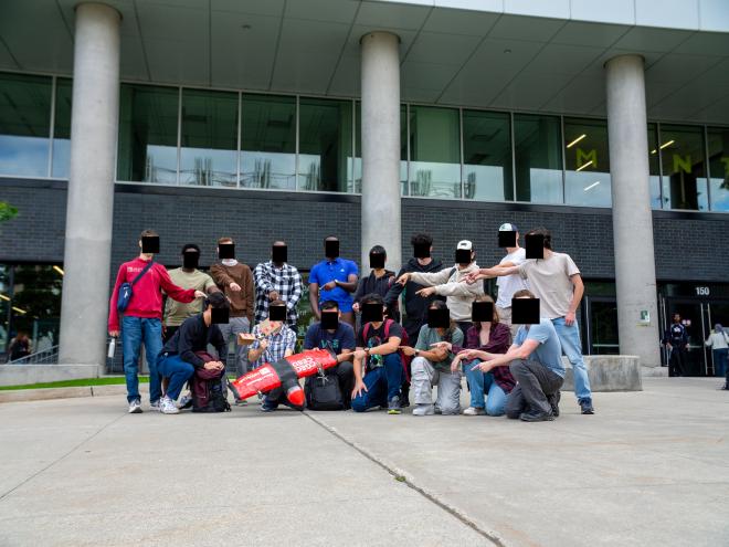 Group photograph of of the University of Ottawa Aerospace research and competition team in front of a University building, taken Fall 2024